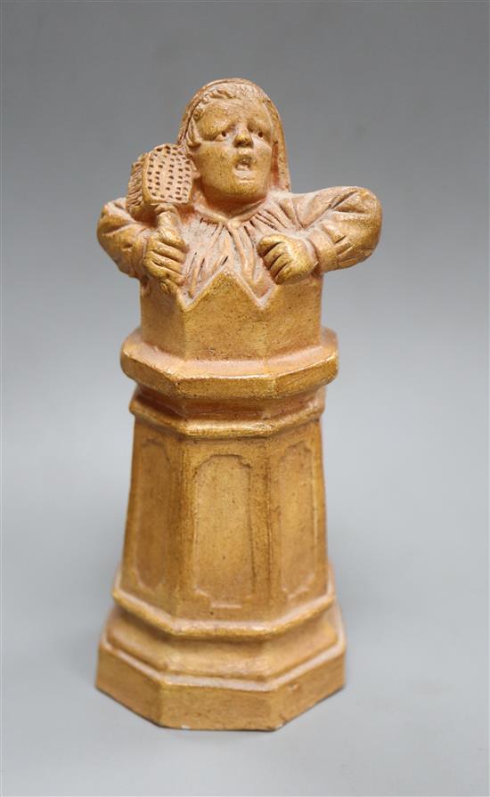 A Doulton style stoneware figure of a woman in a chimney in the manner of George Tinworth, unmarked height 13cm